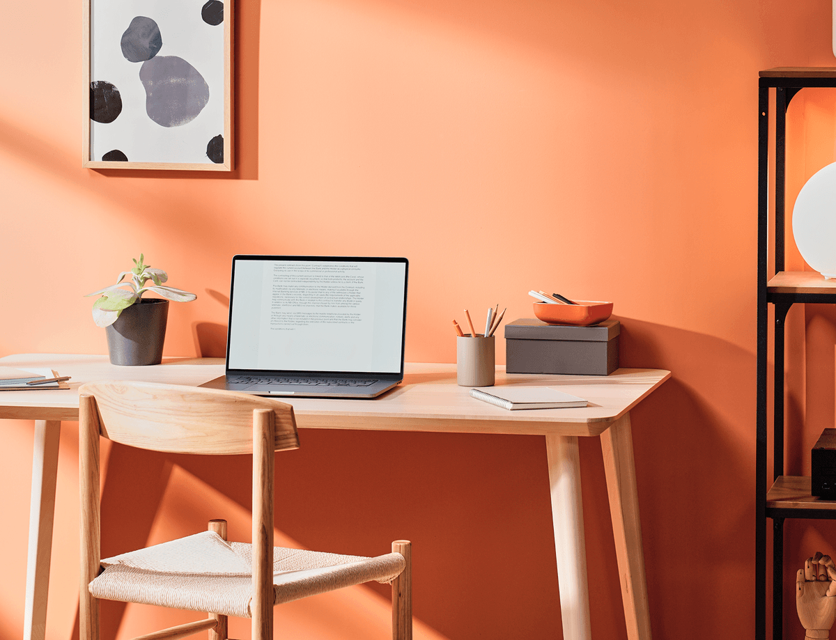 Happy woman waving at laptop during therapy session